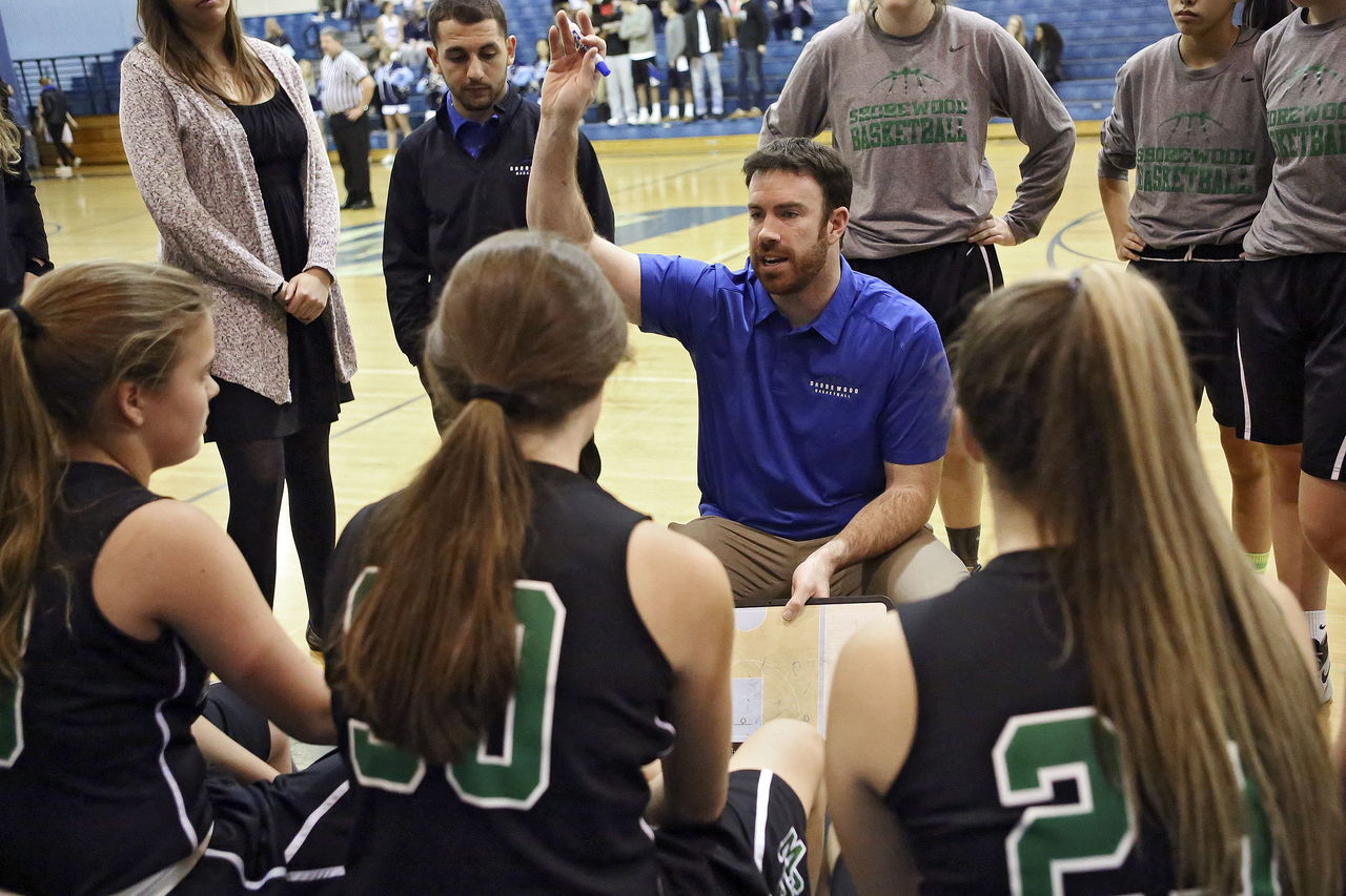 Shorewood’s Mark Haner talks to his team during a game against Meadowdale last month.