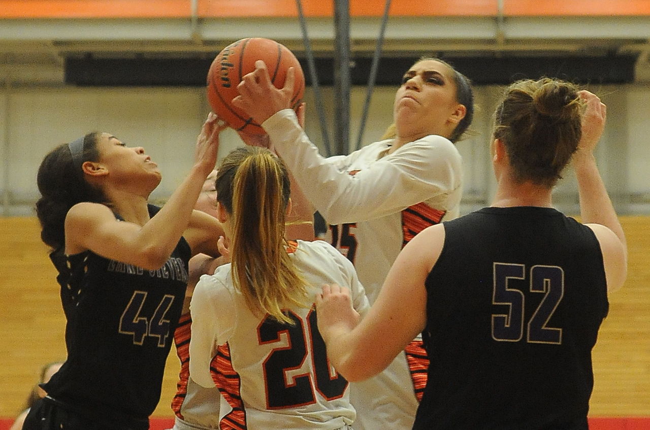 Monroe’s Jadynn Alexander goes up over a crowd of players during a 4A District 1 playoff game against Lake Stevens on Saturday at Everett Community College.