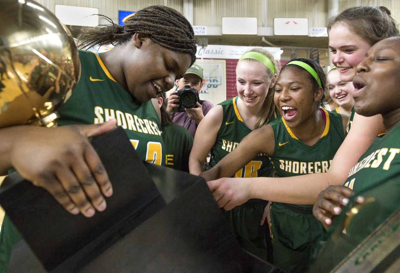 Shorecrest players celebrate after defeating Lynden 49-43 in the Class 2A girls state championship game at the Yakima Valley SunDome on Saturday.