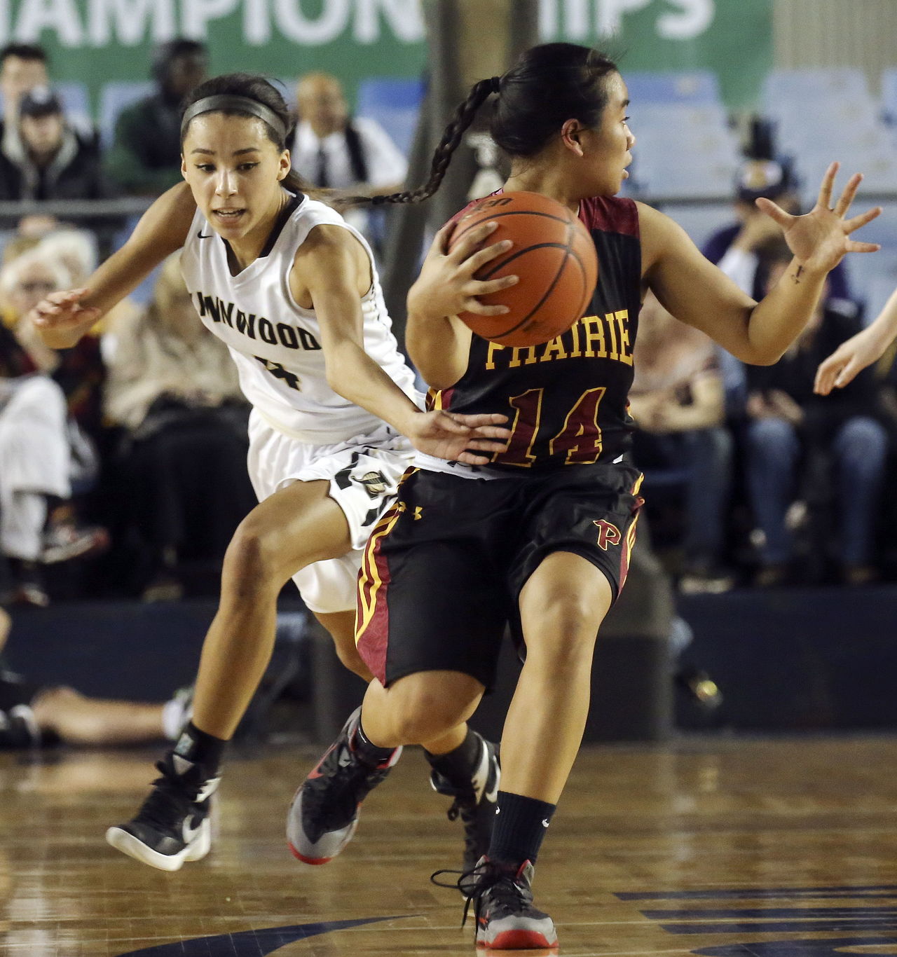 Lynnwood’s Jordyn Edwards attempts to steal from Prairie’s Grace Prom during a 3A state playoff game in Tacoma on Thursday.