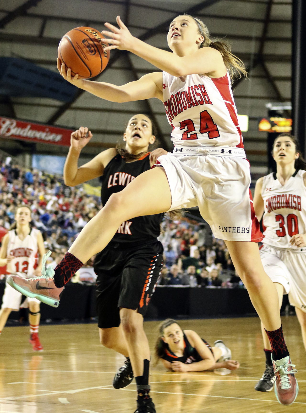 Madison Pollock of Snohomish makes a basket at the buzzer to force overtime in Friday’s 4A state quarterfinal at the Tacoma Dome.