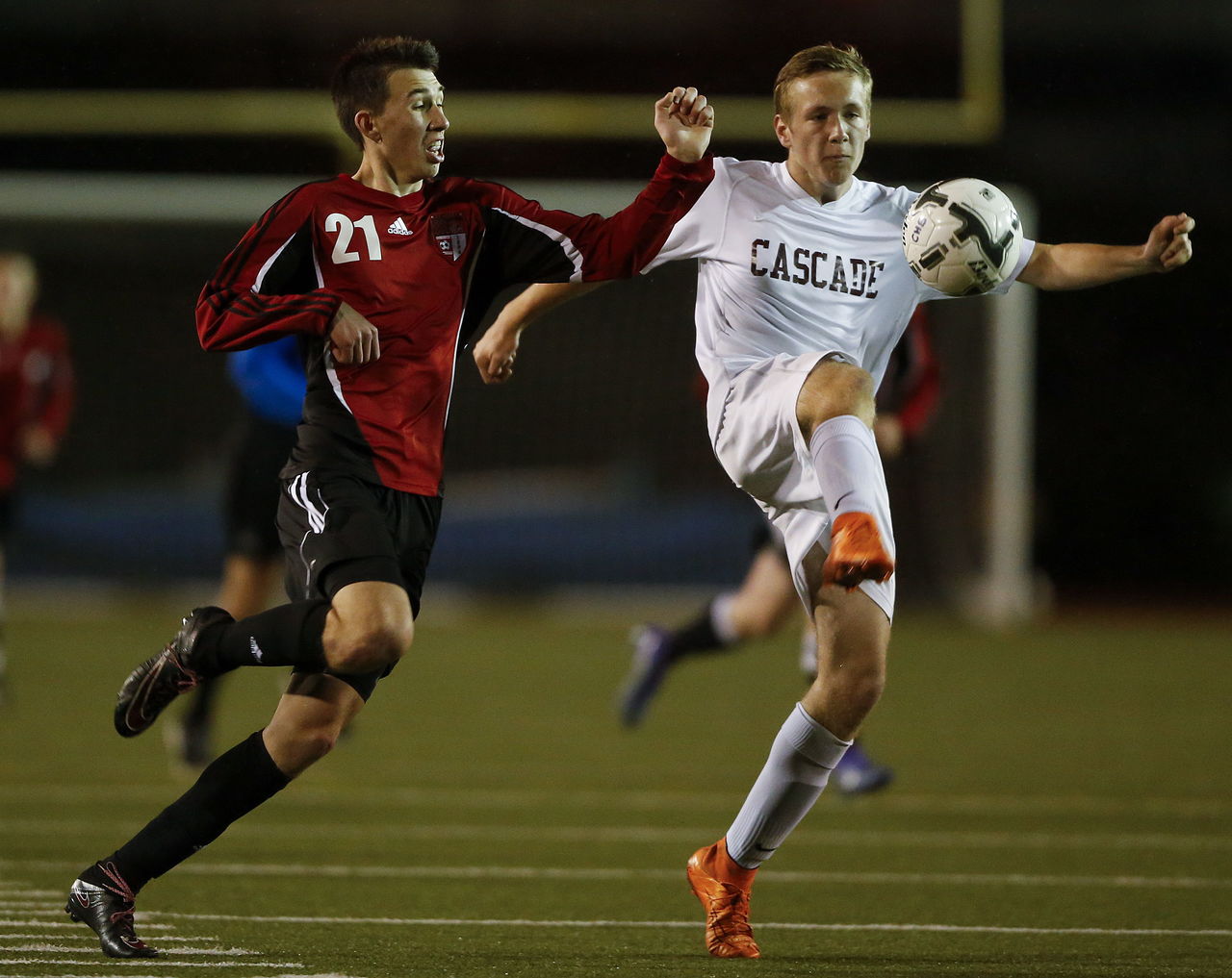 Cascade’s Sean Lucas (right) is pressured by Snohomish’s Logan Stapleton during a Wesco 4A boys soccer match on Tuesday at Everett Memorial Stadium.