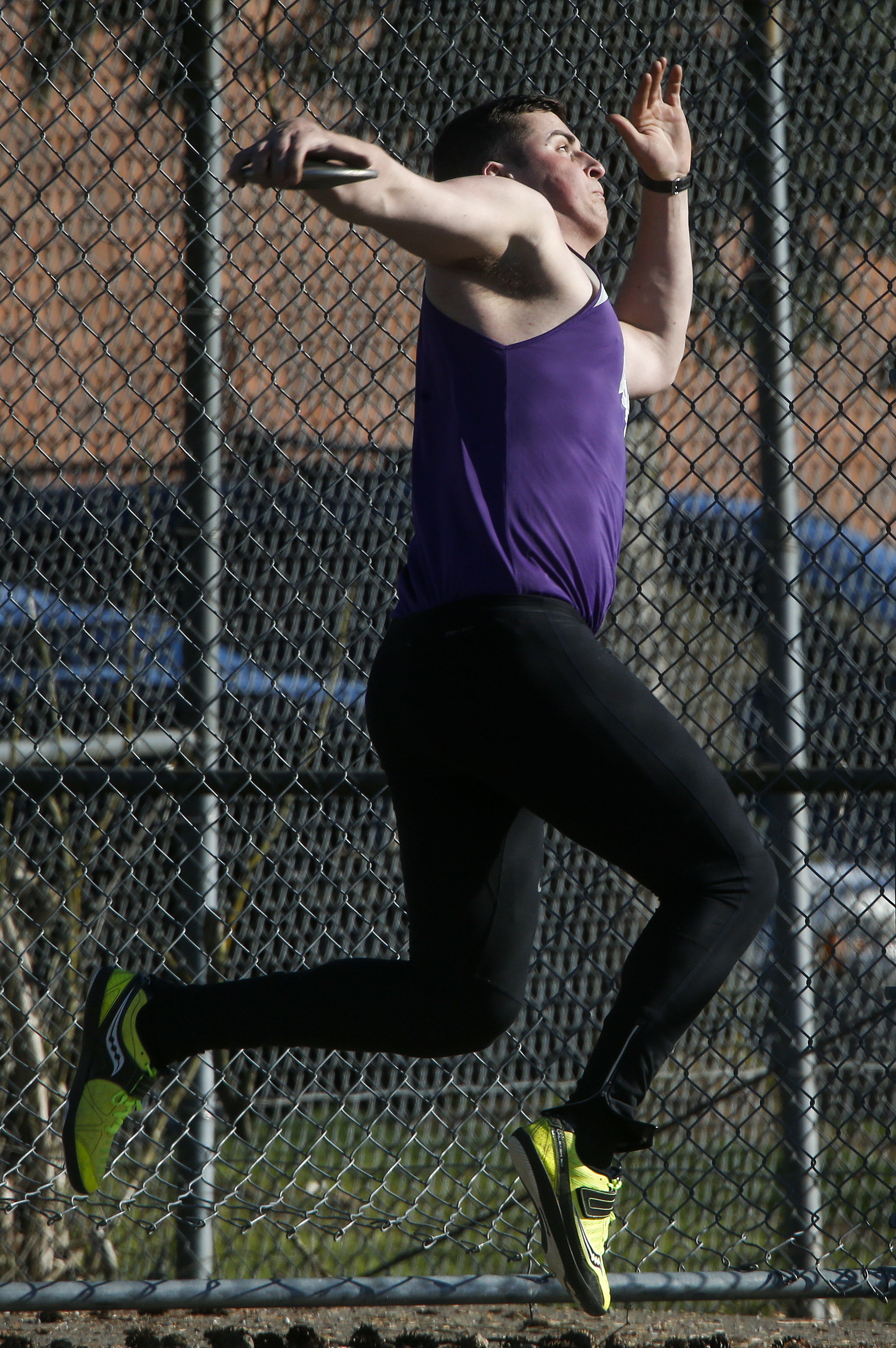 Kamiak track and field athlete Tim Beard winds up to throw during the discus event of a meet at Mariner High School on Thursday, March 31, 2016.