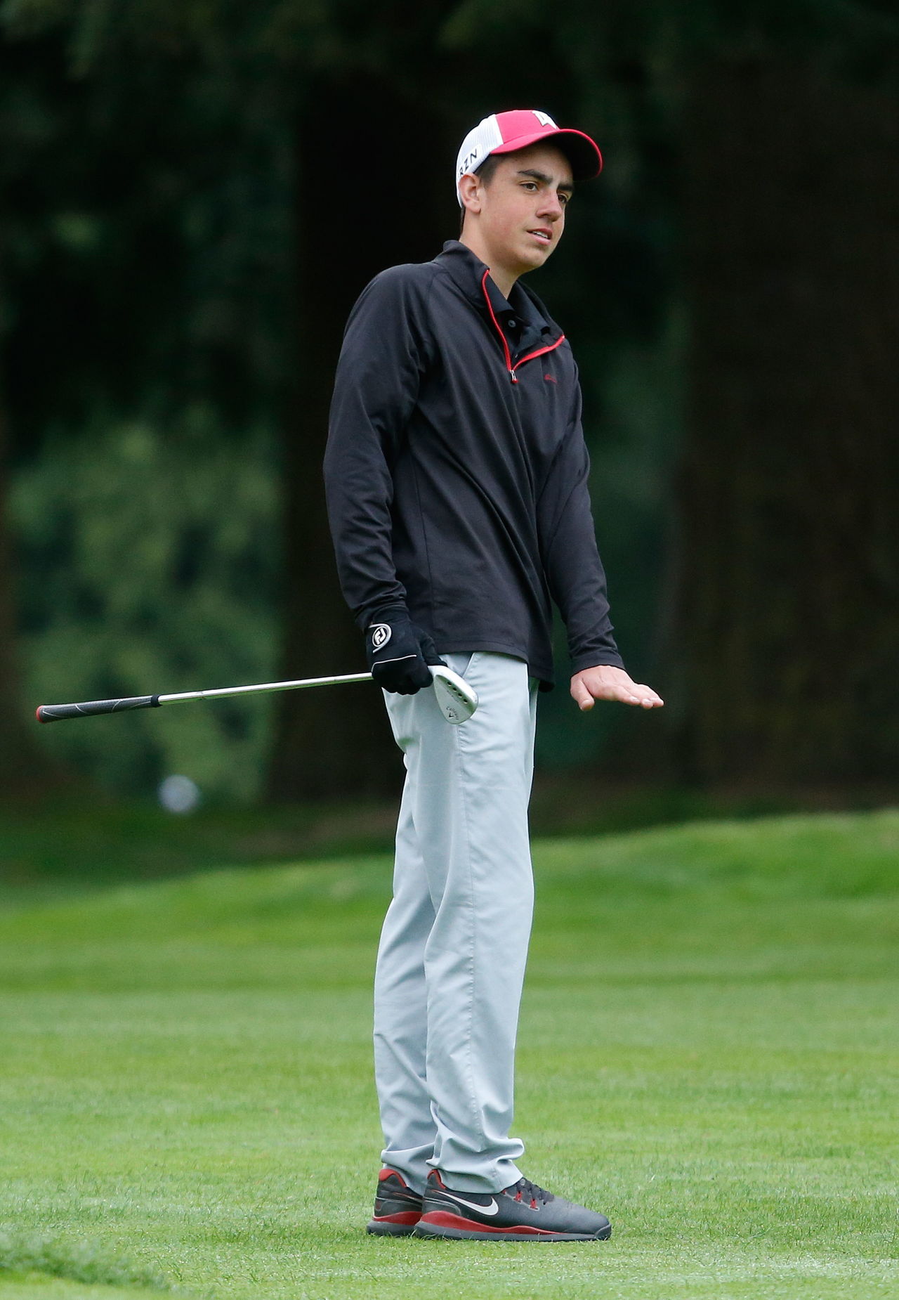Snohomish’s Ben Gardner motions with his hand as the ball rolls to a stop near the cup during the Tom Dolan Memorial Invitational at the Everett Golf & Country Club on Monday. Gardner finished in a four-way tied for fourth with a 74.