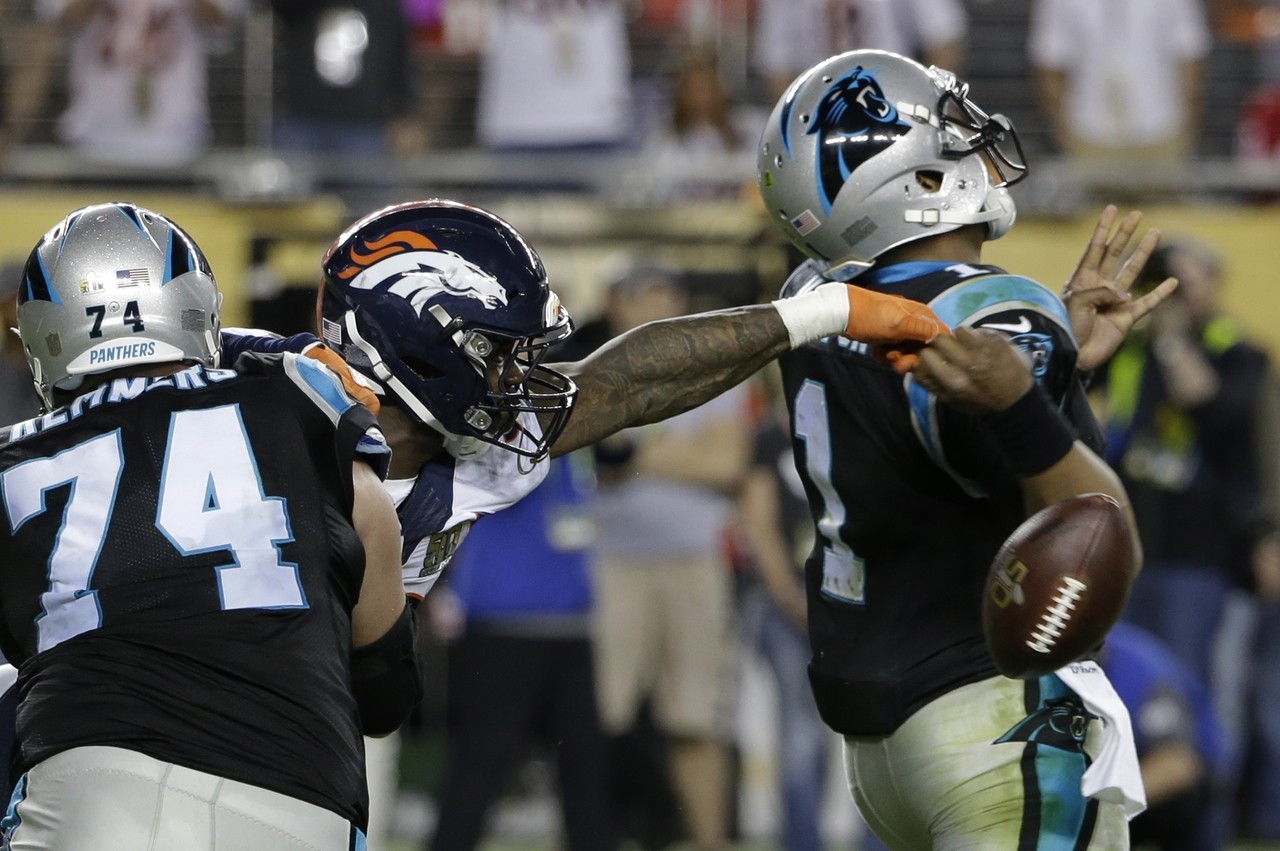 Broncos linebacker Von Miller (58) strips the ball from Panthers’ quarterback Cam Newton (1) during the fourth quarter, setting up a Denver touchdown.