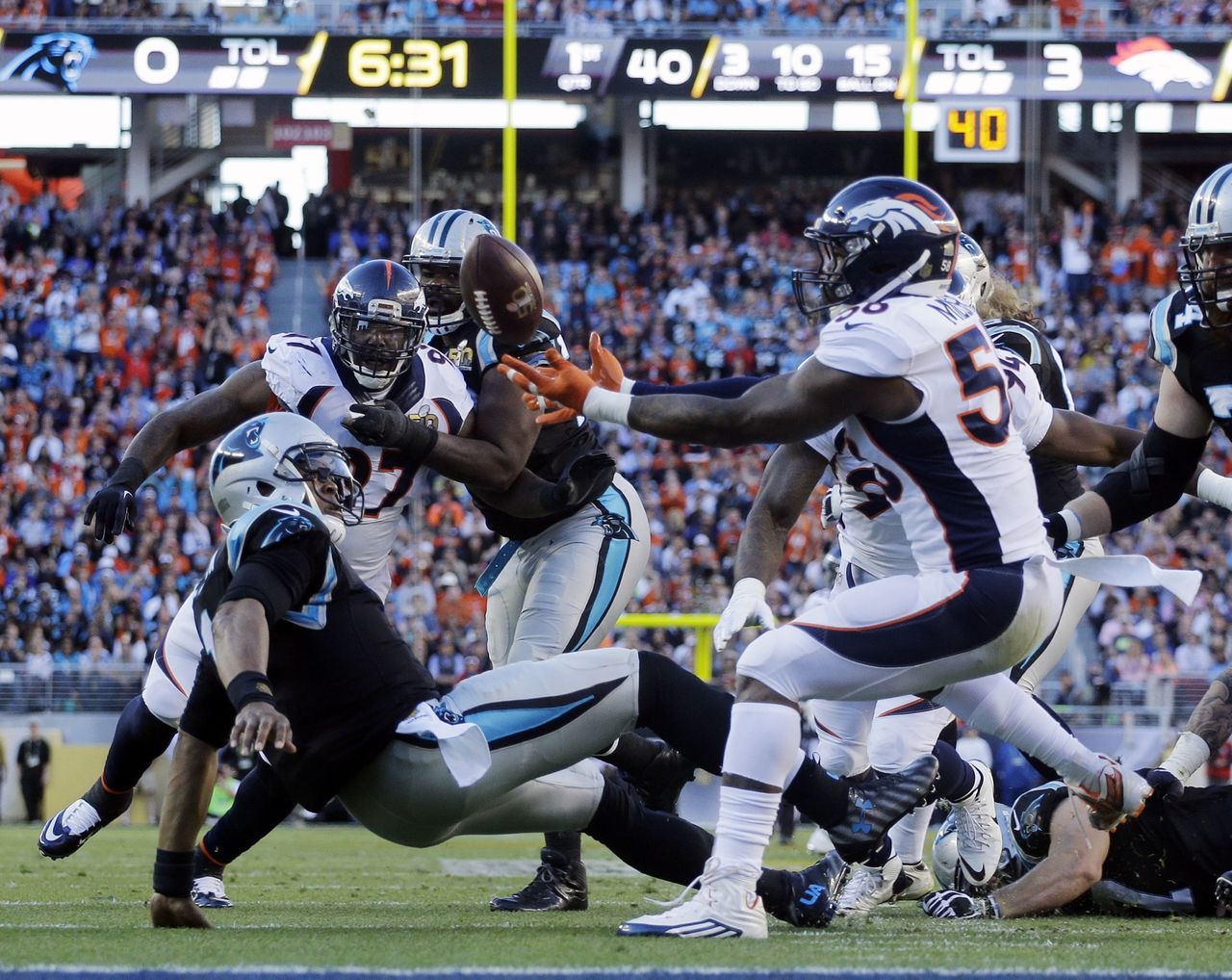 Panthers quarterback Cam Newton (1) fumbles the ball as he is sacked by the Broncos’ Von Miller (58) in the first quarter. Denver recovered the fumble for a touchdown in their 24-10 win over Carolina in the Super Bowl.
