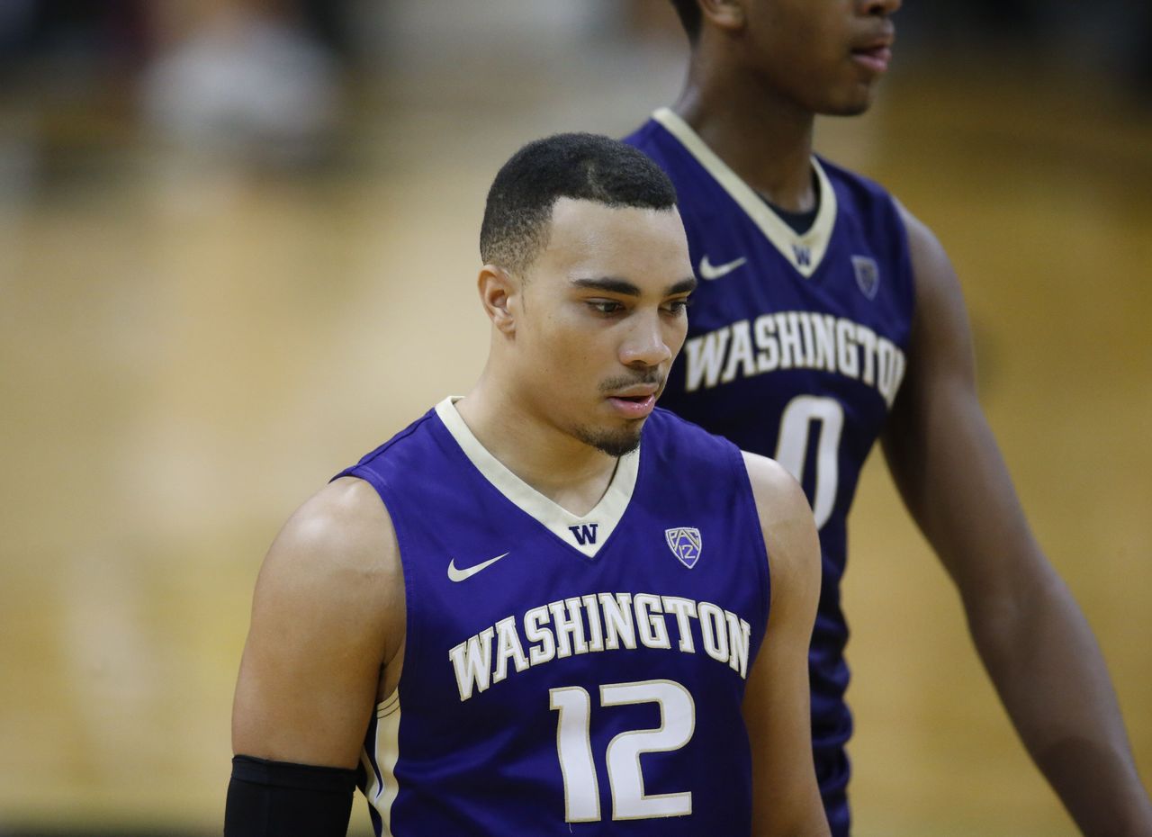 Washington’s Andrew Andrews reacts after missing a shot in the waning seconds of the second half of Saturday’s game against Colorado.