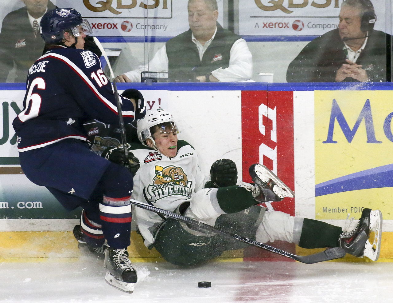 Tri-City’s Beau McCue and the Silvertips’ Connor Dewar collide while struggling for the puck during a game Sunday afternoon at Xfinity Arena in Everett. The Silvertips won 3-2.