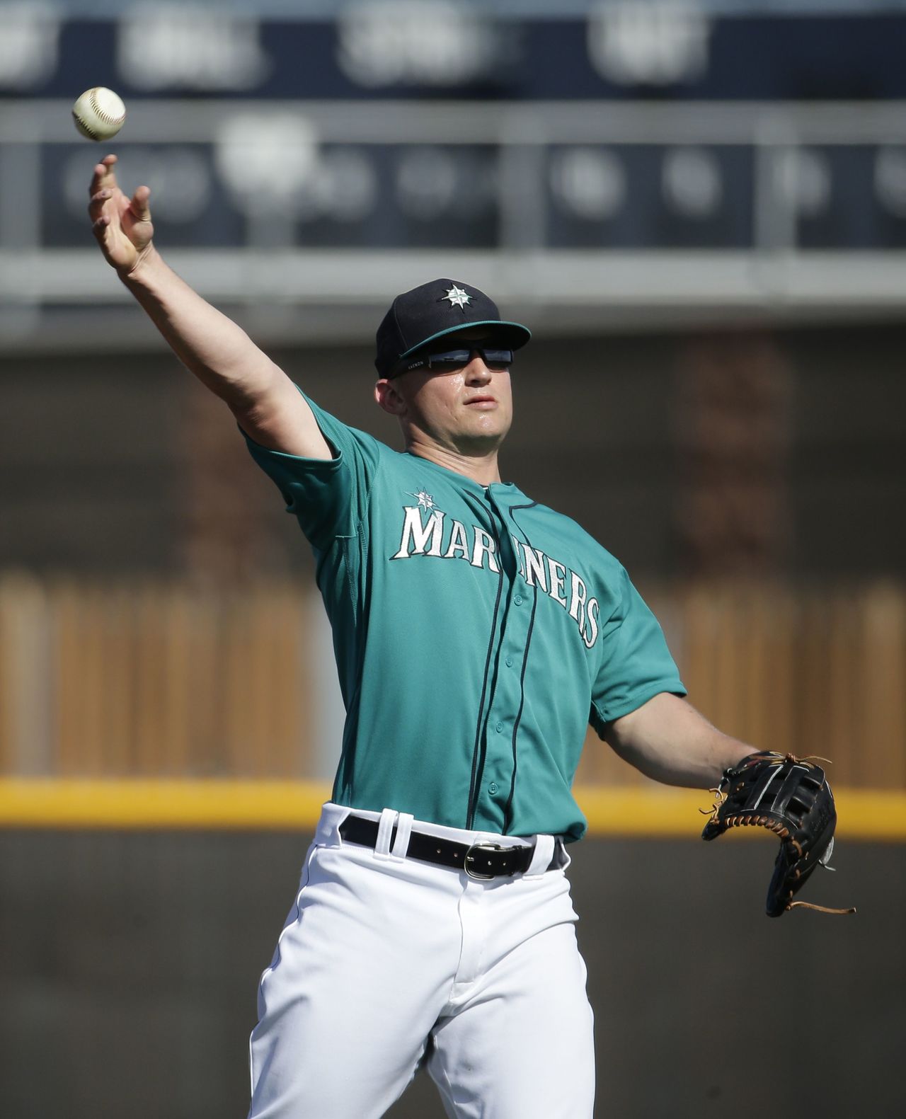 Mariners third baseman Kyle Seager throws during spring practice Saturday in Peoria, Ariz.