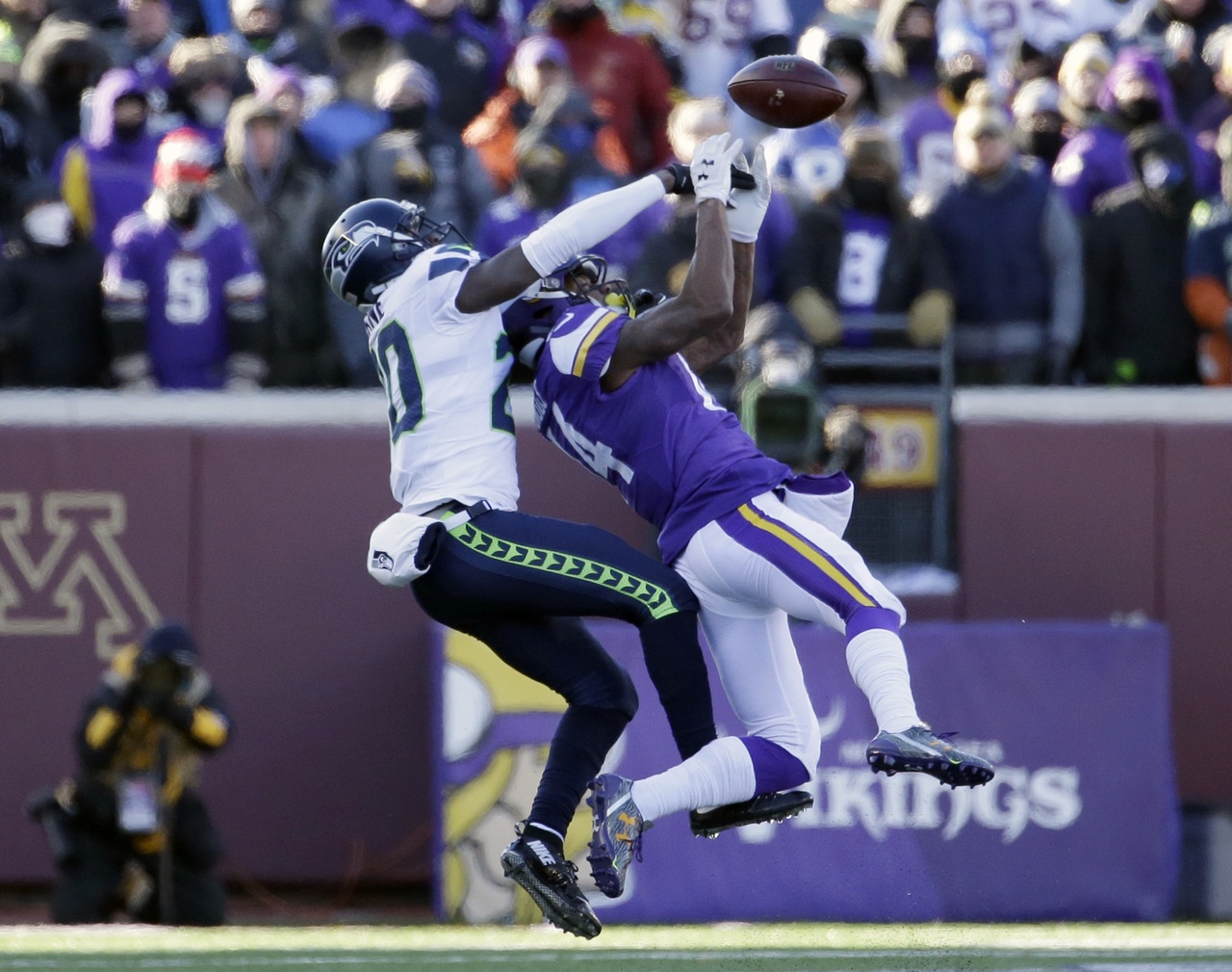 Seahawks cornerback Jeremy Lane (20) breaks up a pass intended for Vikings wide receiver Stefon Diggs (14) during the second half of a wild-card game on Jan. 10 in Minneapolis.