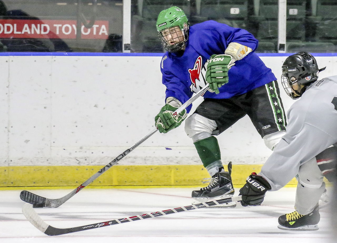Wyatte Wylie (center) became the first Snohomish County native to be both drafted and signed by the Silvertips when he signed a deal Thursday.