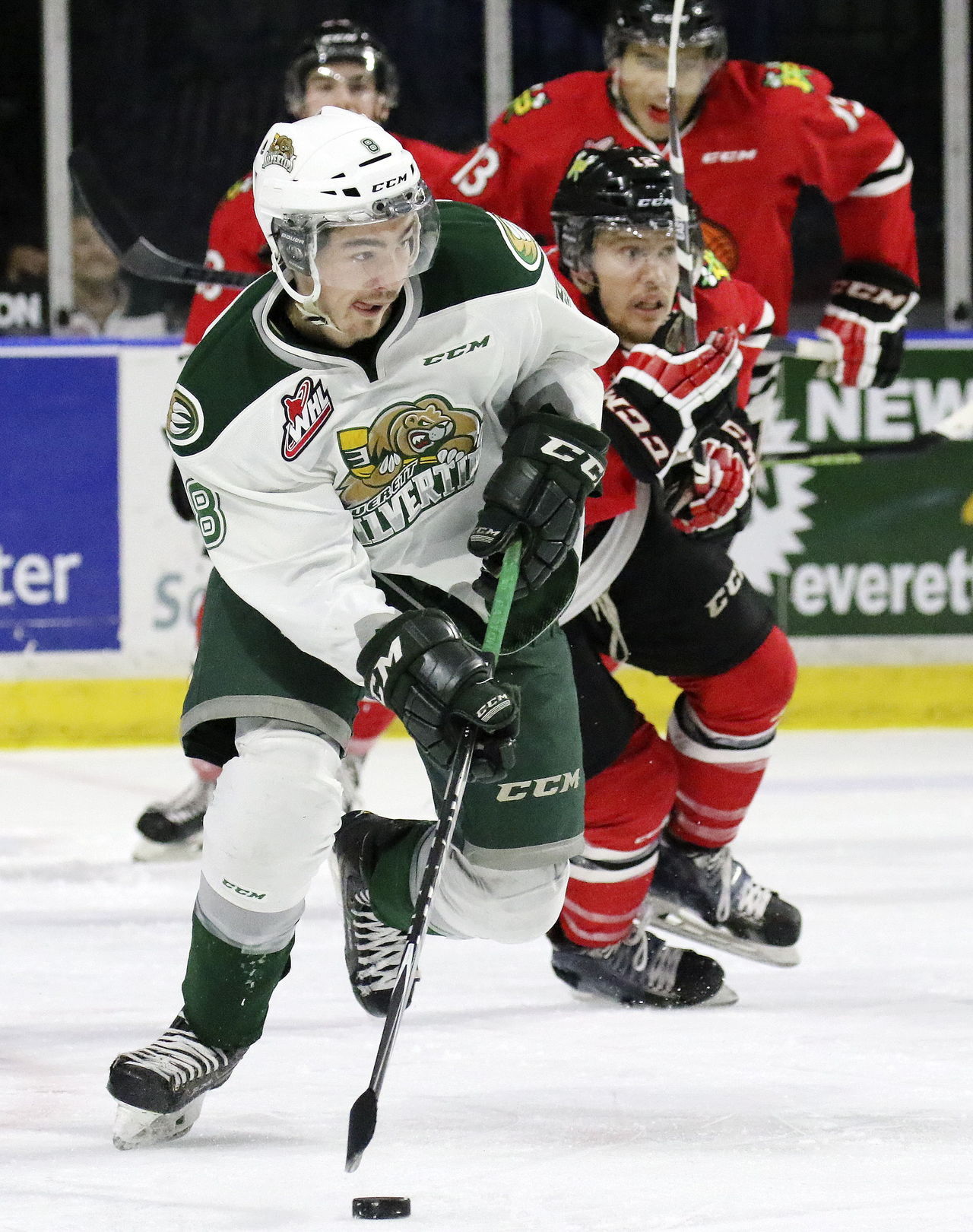 The Silvertips’ Patrick Bajkov gets out front of the Winterhawks’ Miles Koules during a game last season at Xfinity Arena in Everett.
