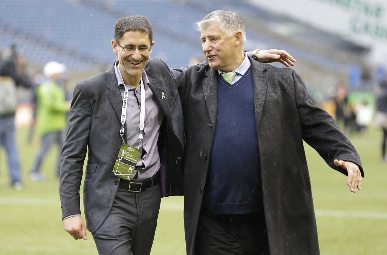 Seattle Sounders owner Adrian Hanauer (left) and coach Sigi Schmid (right) shown here after a 2014 match, will try to lead the proud club back to prominence after an uncharacteristically disappointing 2015 season.