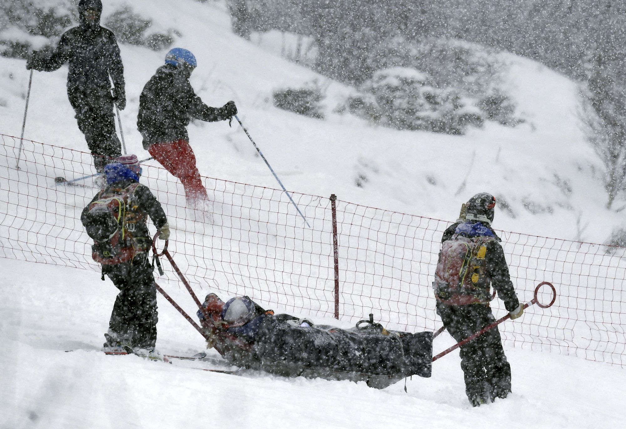 Rescue workers carry skier Lindsey Vonn off the course after she fell Saturday during a women’s World Cup alpine ski super G race in Soldeu, Andorra.