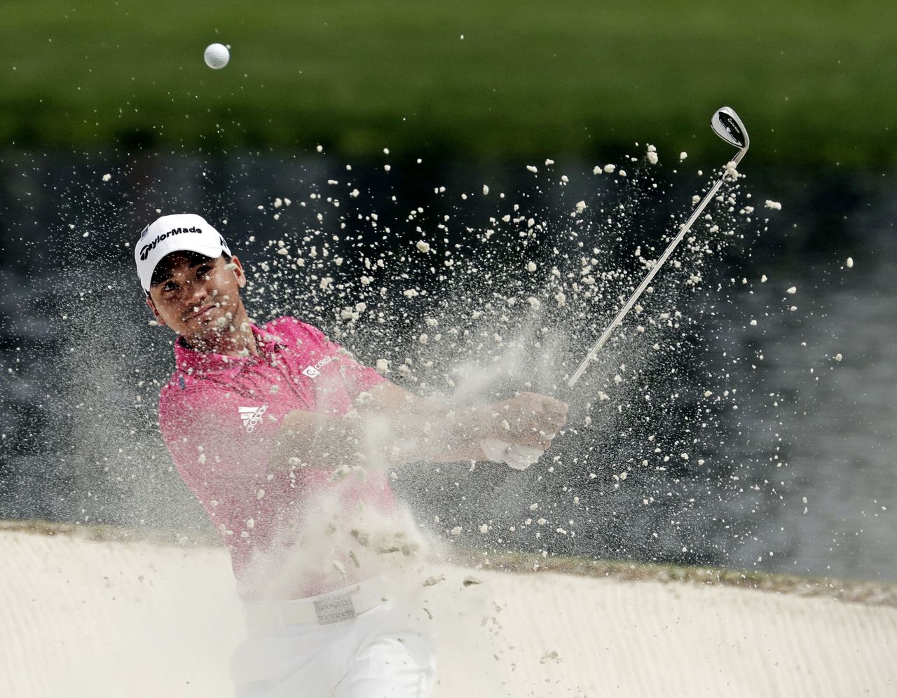 Jason Day hits out of a bunker on during the par three competition at the Masters on Wednesday.