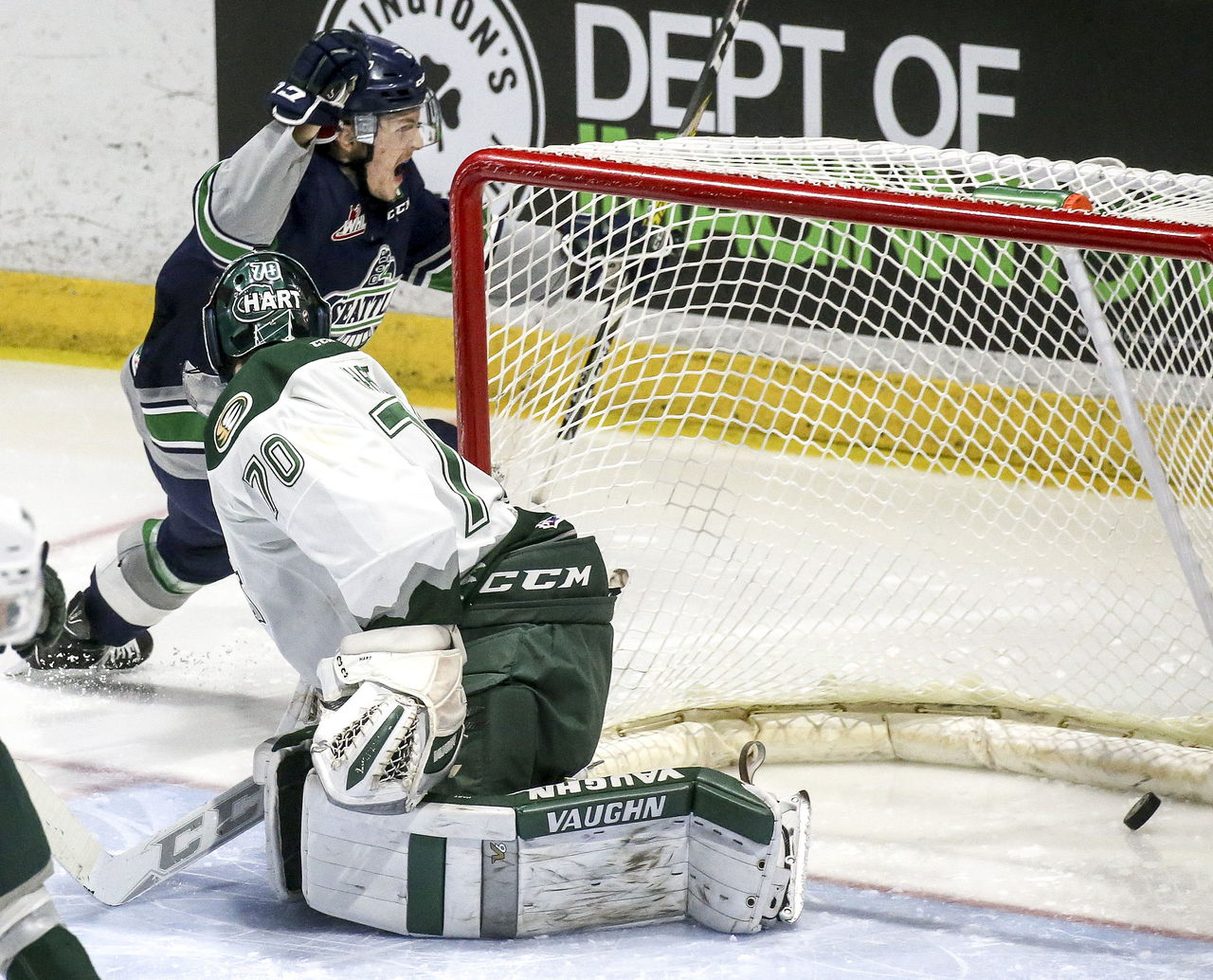 The Thunderbirds’ Scott Eansor celebrates his goal past Silvertips goaltender Carter Hart in the second period of a playoff game Wednesday night in Everett.