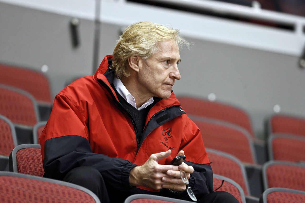 In this Jan. 15, 2013 photo, Phoenix Coyotes general manager Don Maloney watches a Coyotes NHL hockey practice in Glendale, Ariz. A person with direct knowledge of the decision tells The Associated Press that the Arizona Coyotes plan to relieve Maloney of his duties.