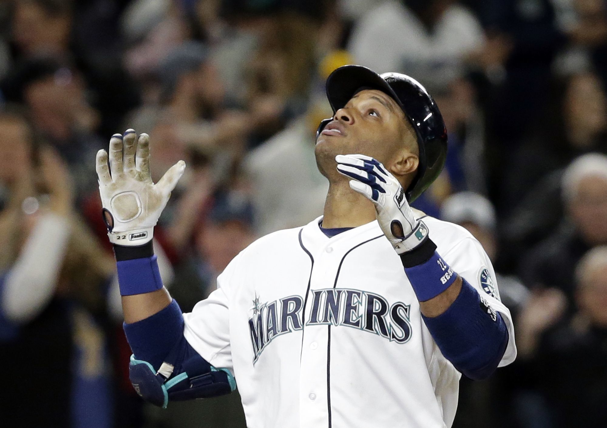 The Mariners’ Robinson Cano celebrates as he crosses home plate after hitting a grand slam in the seventh inning of Tuesday’s game against the Houston Astros.