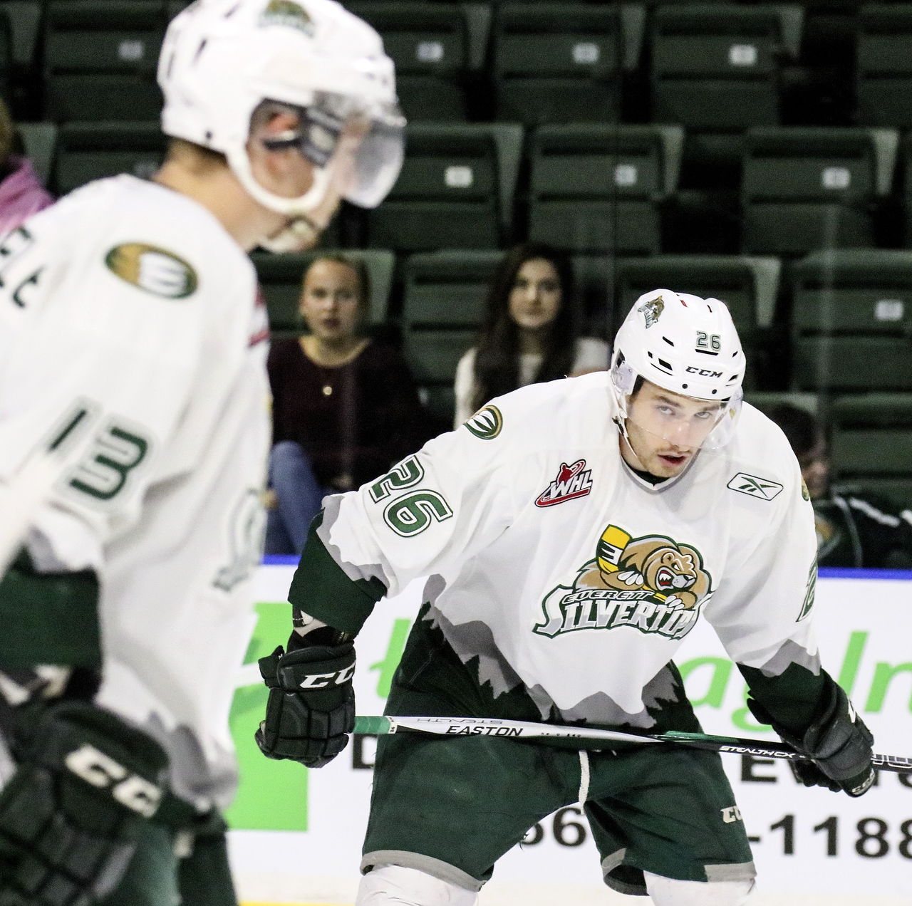 Silvertips overagers Cole MacDonald (right) and Remi Laurencelle await the faceoff during a game this past season at Xfinity Arena.