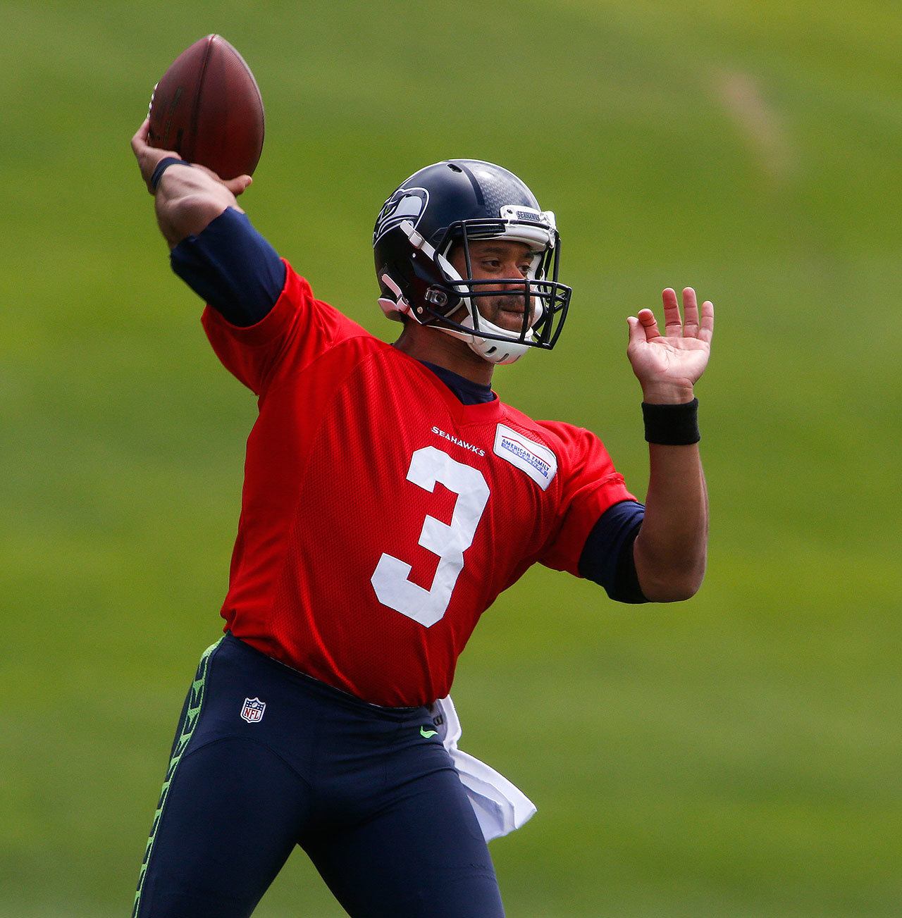 Seattle Seahawks quarterback Russell Wilson, seen here throwing during a team minicamp at Virginia Mason Athletic Center in Renton in June, knows the expectations for the team are again lofty. (Ian Terry / The Herald)