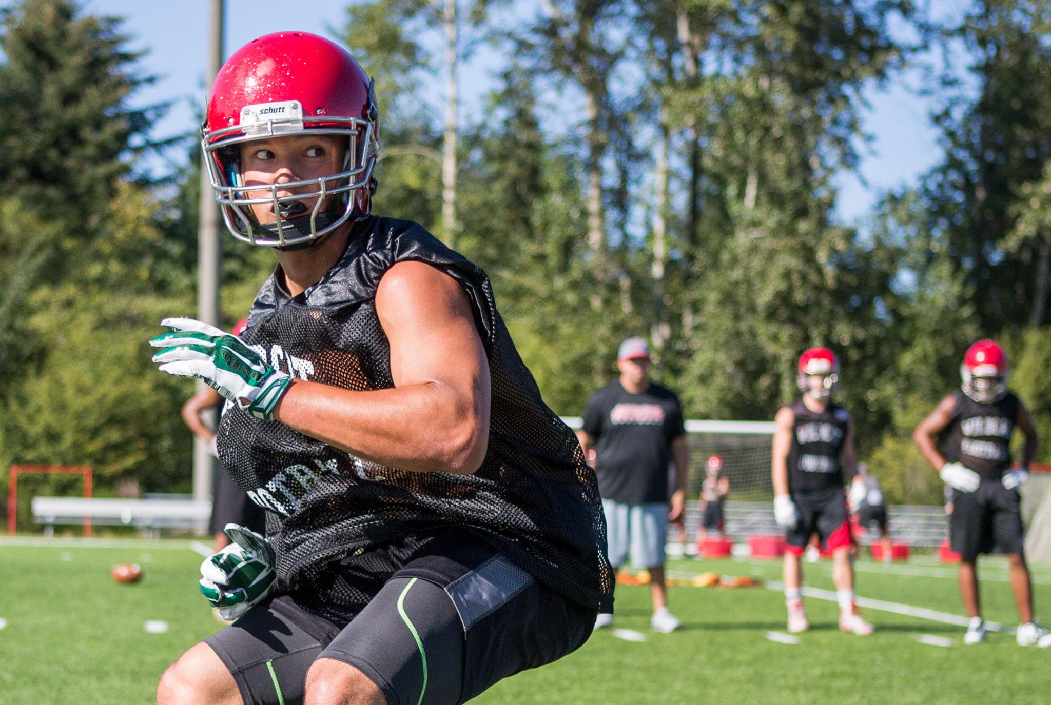 Collin Montez runs a drill during the first day of practice Aug. 17 at Archbishop Murphy High School in Everett. Montez, the former Marysville Getchell standout running back, transferred for his senior year. (Kevin Clark / The Herald)
