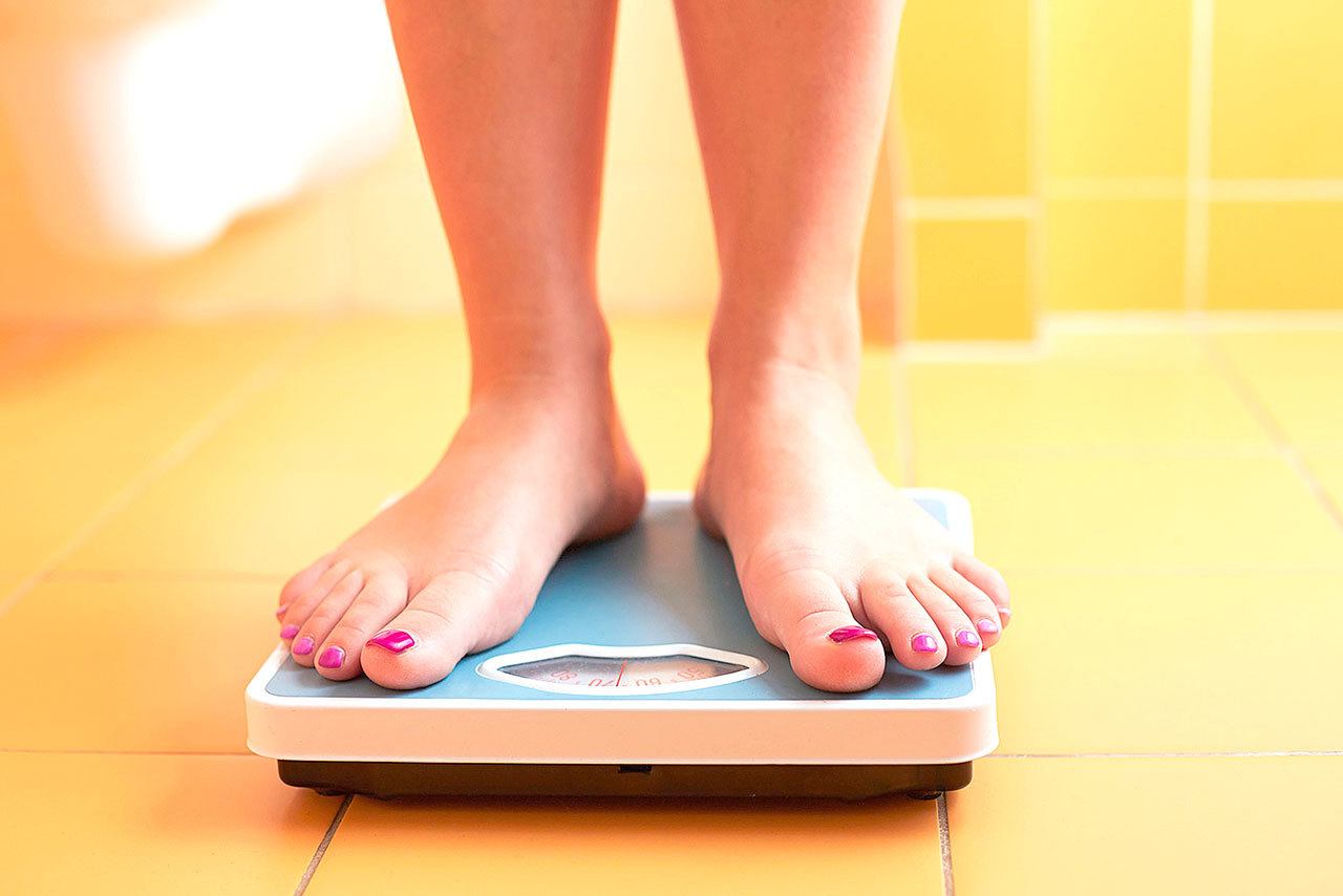 Women have surpassed men in obesity rates, according to a national report released this summer. (Photo/Fotolia)