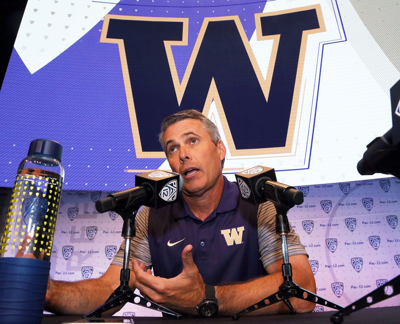 Washington head coach Chris Petersen speaks at Pac-12 media day in Los Angeles on July 15. (AP Photo/Reed Saxon)