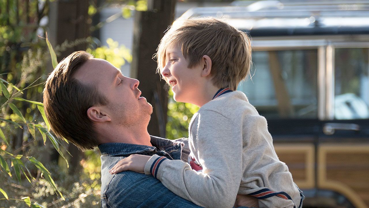 The title character (Aiden Longworth) in happier times with stepdad Aaron Paul in a scene from “The 9th Life of Louis Drax.”