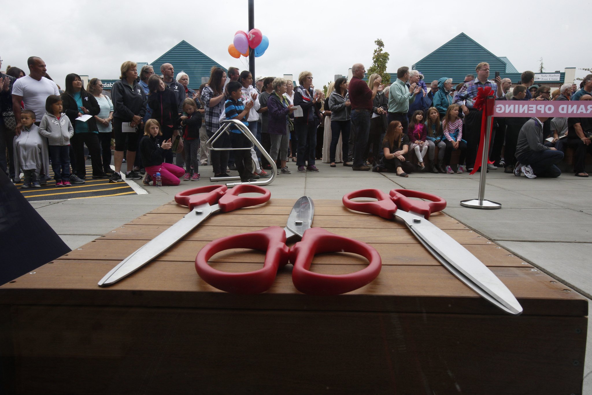 Oversized scissors rest on a table before the Grand Opening of the Stanwood-Camano YMCA on Sept. 3, 2016, in Stanwood. (Andy Bronson / The Herald)