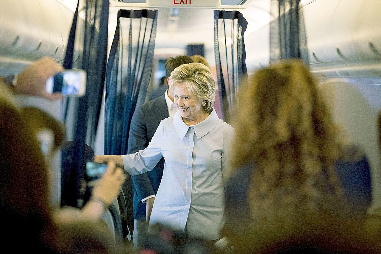Democratic presidential candidate Hillary Clinton speaks to members of the media on her first flight on a new campaign plane before taking off at the Westchester County Airport in White Plains, New York, on Monday to travel to Cleveland Hopkins International Airport for Labor Day events. (AP Photo/Andrew Harnik)