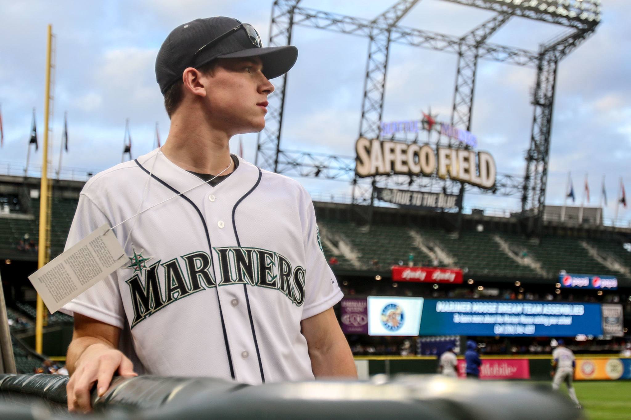 Silvertips goaltender Carter Hart waits to throw out the ceremonial first pitch before the Mariners game against the Rangers on Wednesday night at Safeco Field in Seattle. (Kevin Clark / The Herald)