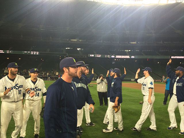AquaSox players celebrate after an 8-0 win over the Indians in a playoff game Friday night at Safeco Field in Seattle. (Jesse Geleynse photo)