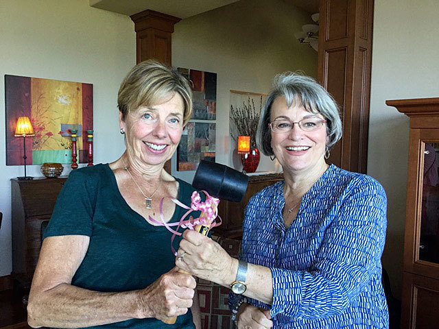 Past President Nancy Tilschner passes the gavel to incoming Providence General Children’s Association President, Mary Lou Finley. (Contributed photo)