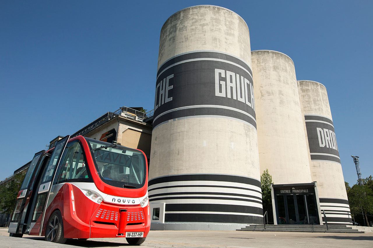 The driverless electric free shuttle Navly drives through a district of Lyon, France, as part of an experiment on Sept. 9. The full-electric autonomous vehicle is made by French company Navya. (AP Photo / Laurent Cipriani)