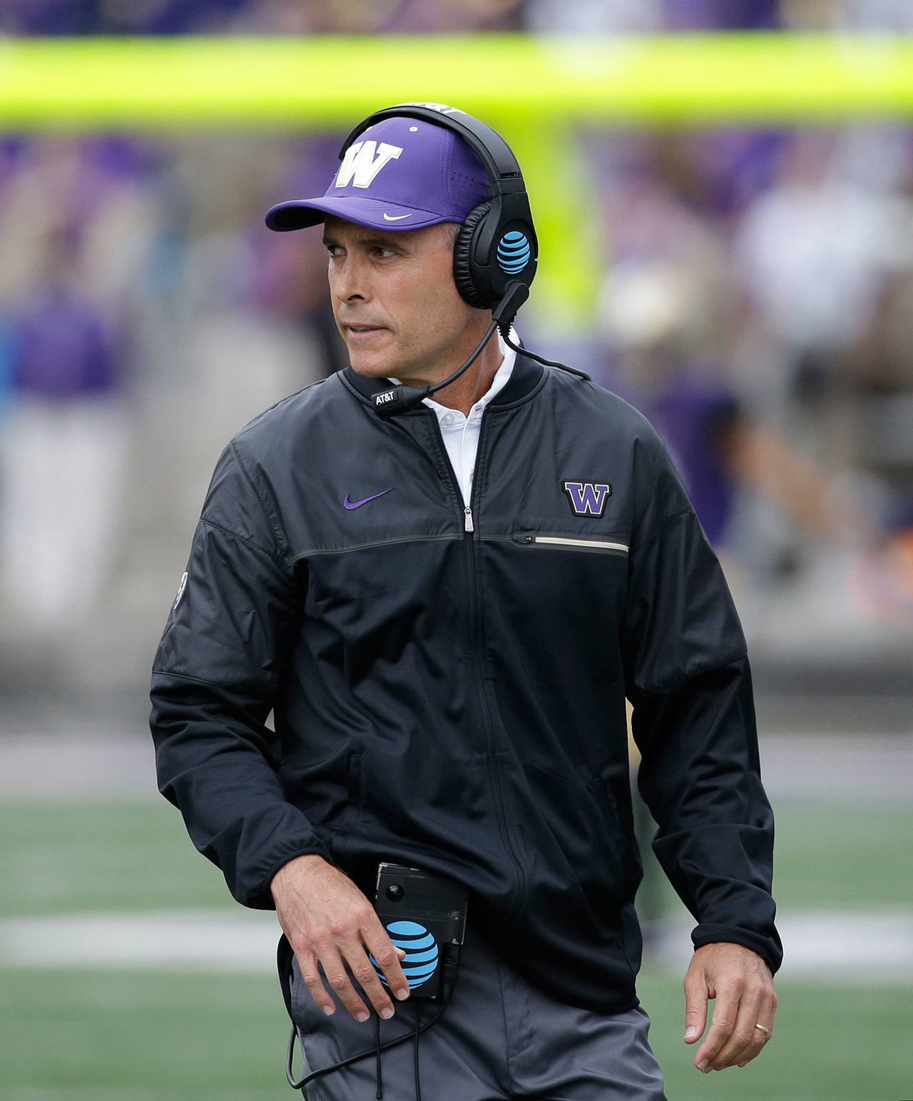 Washington head coach Chris Petersen stands on the sidelines during a game against Rutgers on Sept. 3 in Seattle. (AP Photo/Elaine Thompson)