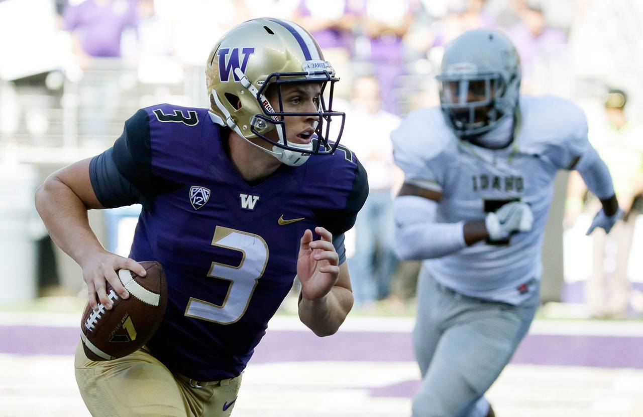 Washington quarterback Jake Browning (3) scrambles during a game against Idaho on Sept. 10 in Seattle. (AP Photo/Ted S. Warren)