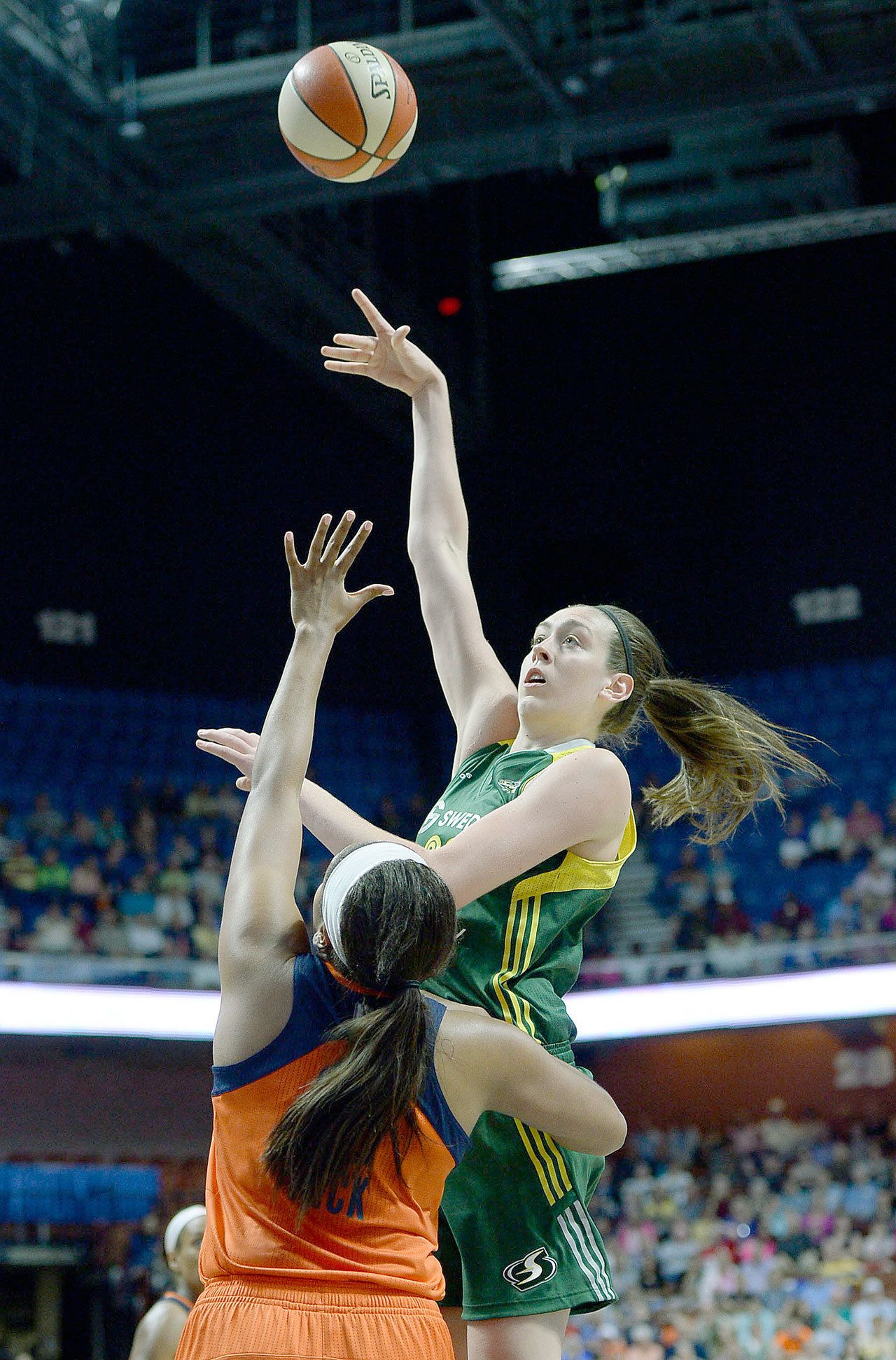 Seattle’s Breanna Stewart shoots over Connecticut’s Morgan Tuck during a game on June 10. Stewart won the WNBA’s Rookie of the Year award on Tuesday and Tuck, her former UConn teammate, joined Stewart on the all-rookie team. (AP Photo/Jessica Hill)