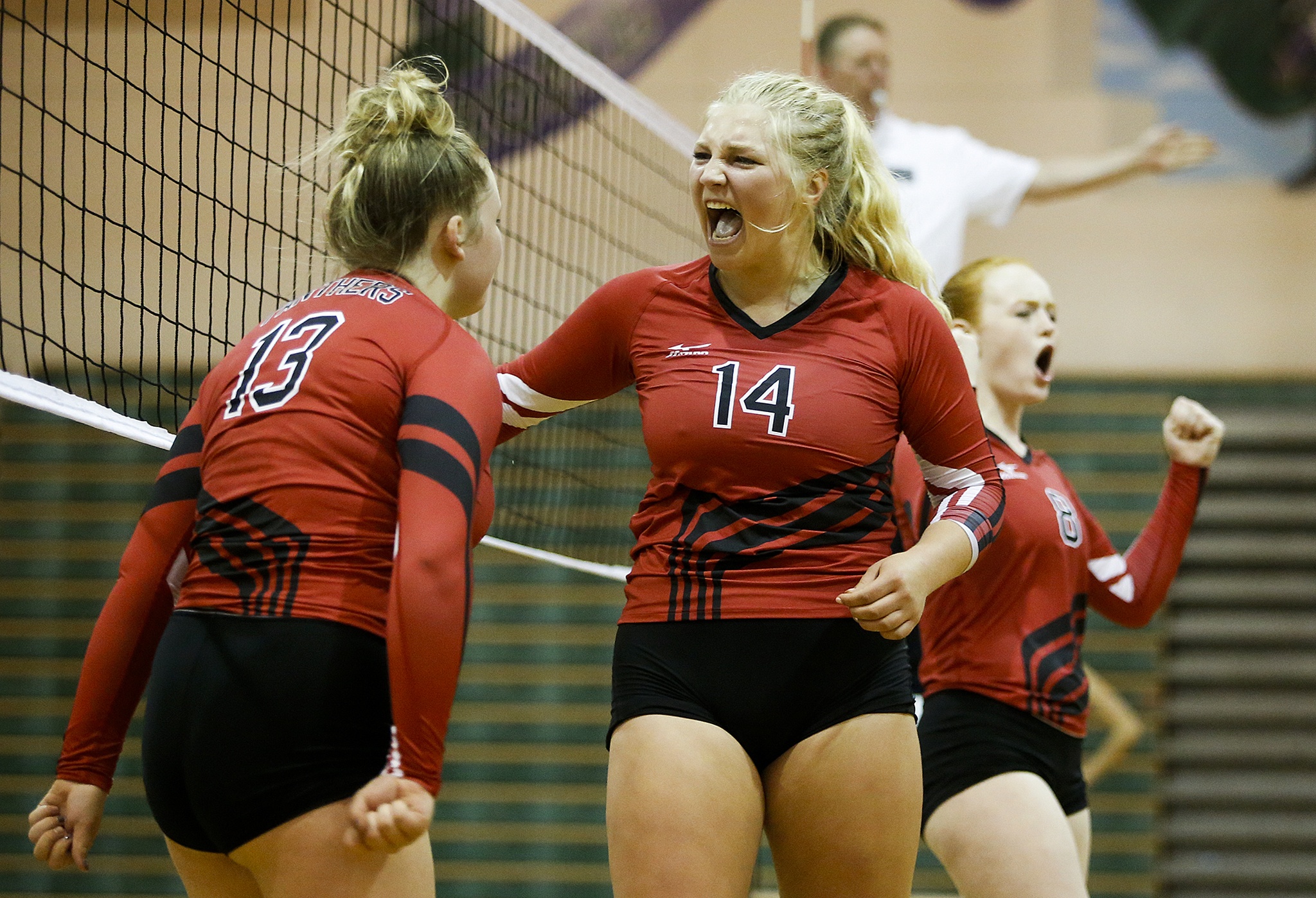 Snohomish’s Margaret Thunselle (14) celebrates a point with teammate Isabelle Strehle (13) during the Panthers’ five-set victory at Edmonds-Woodway on Thursday. (Ian Terry / The Herald)