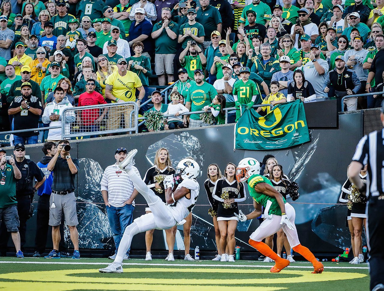Colorado defensive back Ahkello Witherspoon (23) catches the game-winning interception intended for Oregon wide receiver Darren Carrington II (7) during the last moments of a game Saturday in Eugene, Ore. (AP Photo/Thomas Boyd)