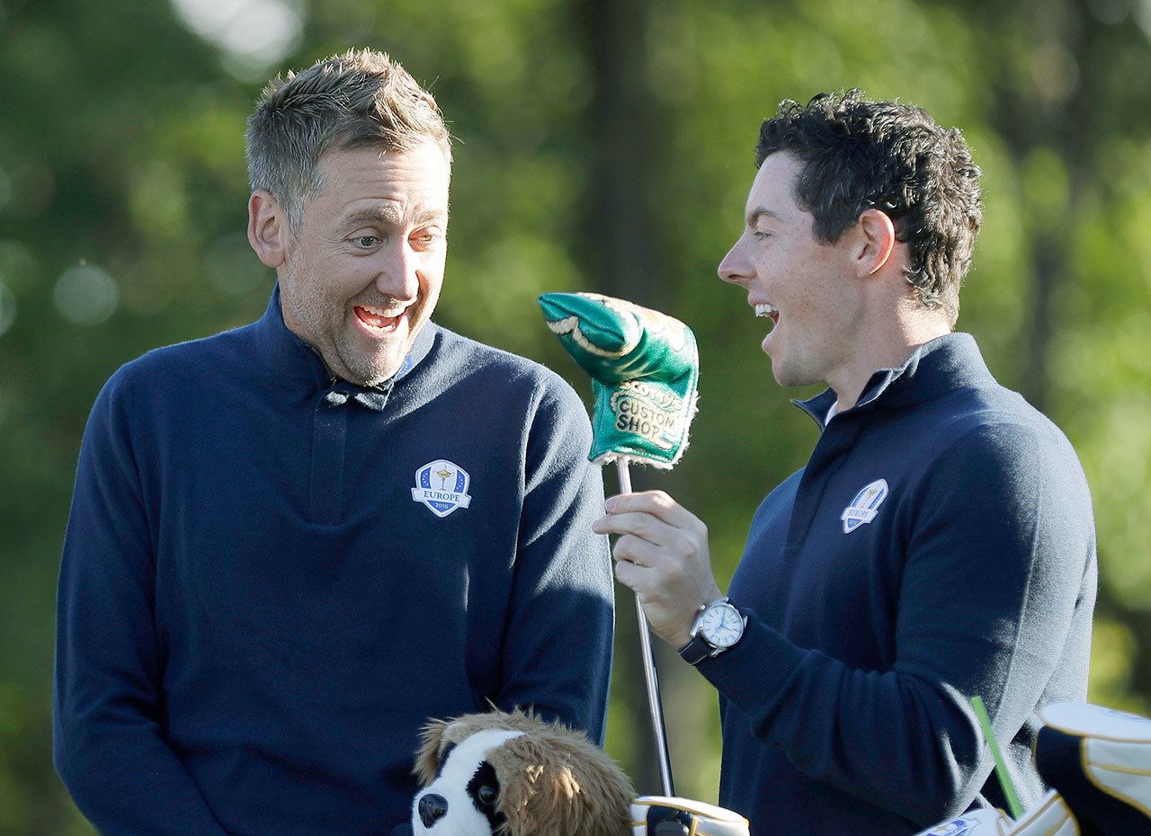 Europe vice-captain Ian Poulter shares a laugh with Rory McIlroy before a practice round for the Ryder Cup on Tuesday at Hazeltine National Golf Club in Chaska, Minn. (AP Photo/David J. Phillip)