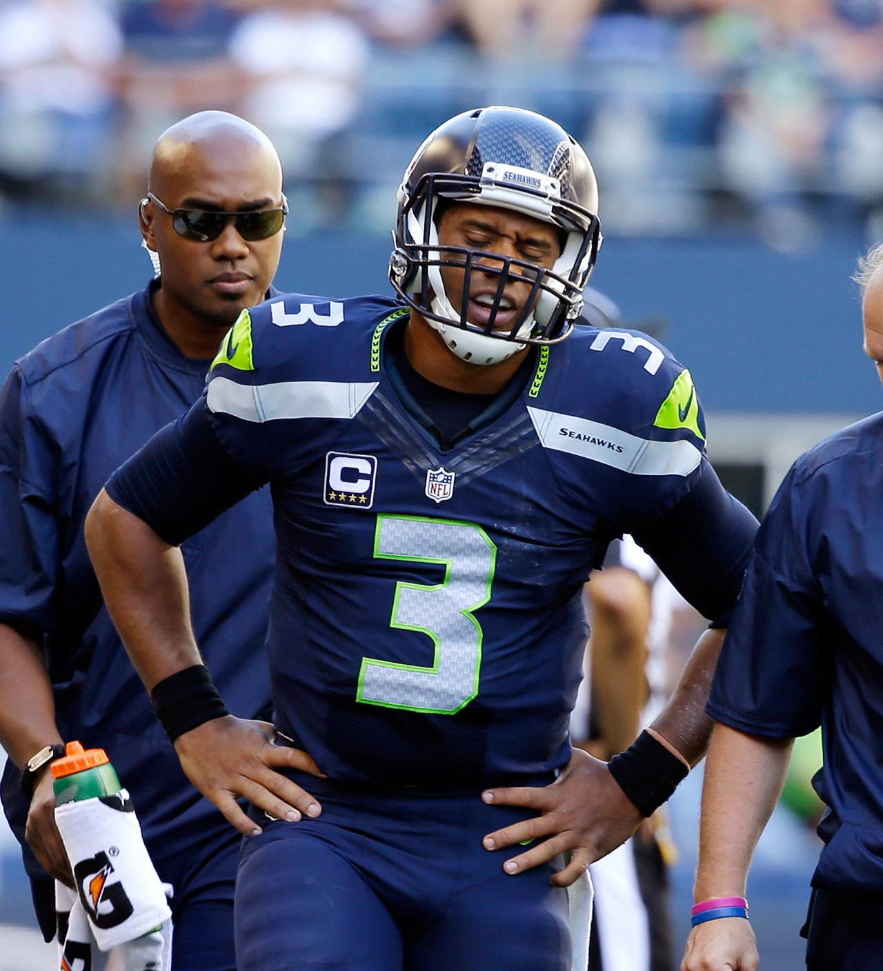 Seahawks quarterback Russell Wilson walks off the field after being injured against the 49ers in the second half of a game this past Sunday in Seattle. (AP Photo/Ted S. Warren)