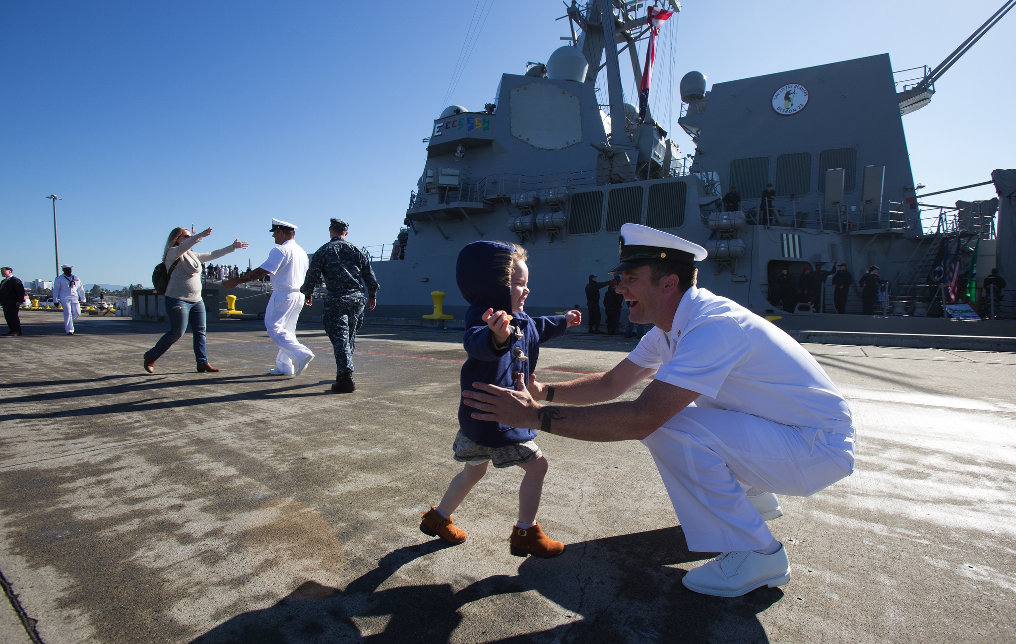 Amelia Carpenter, 3, runs to her father Chief Travis Carpenter during the USS Sampson (DDG 102) arrival at Naval Station Everett on Monday. The Arleigh-Burke Class destroyer is the second of four new destroyers to be based in Everett. (Andy Bronson / The Herald)