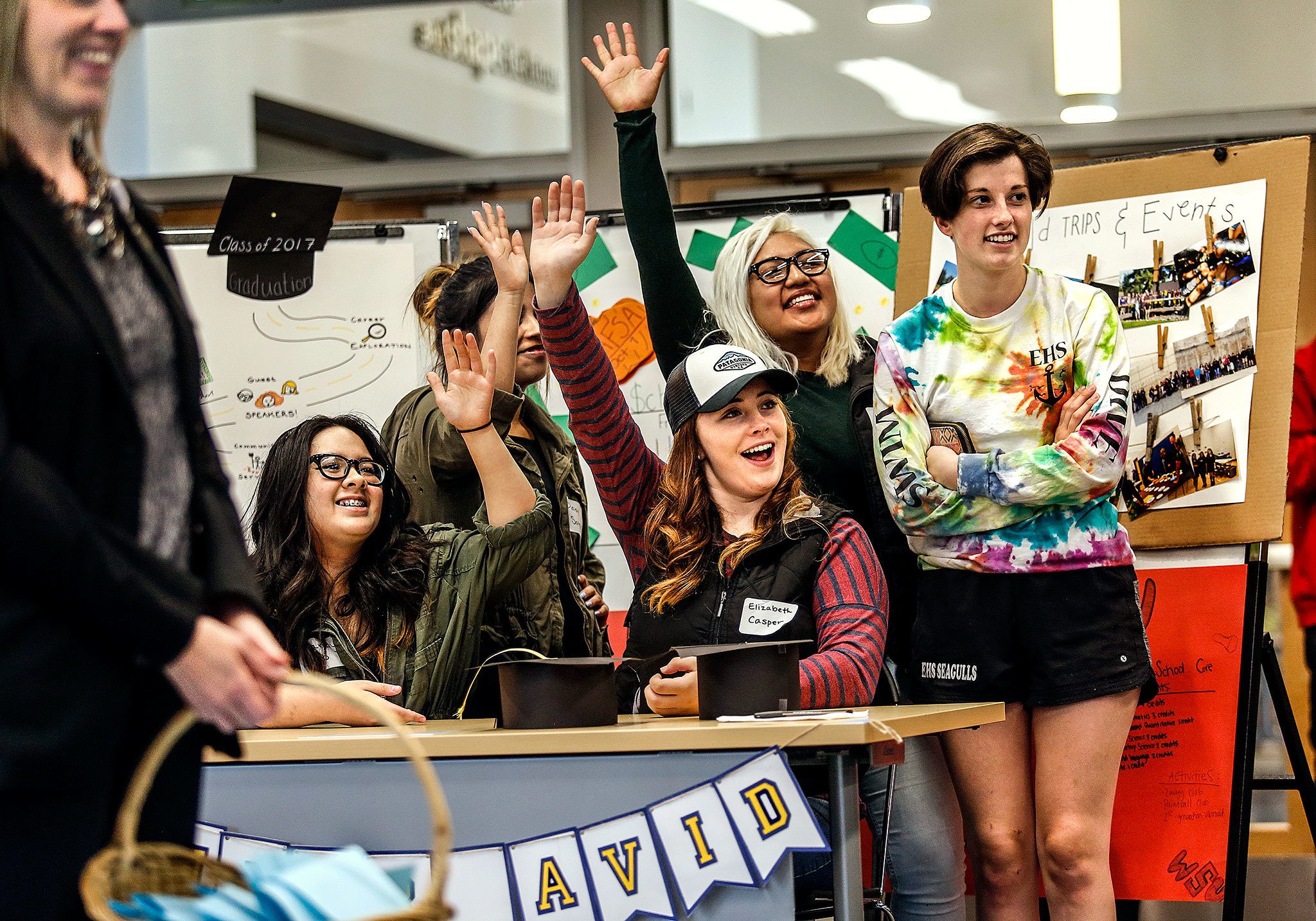 Senior class members of Everett High School’s AVID program respond to speaker Christian Paige’s request for the audience to raise their hands and say, “I am!” periodically during his performance of spoken word poetry Thursday night at a kick-off event for the Rotary Club of Everett, which announced a $100,000 commitment to the Everett School District’s AVID program. The senior girls are (from left) Sandy Vo, Daisy Sotelo, Elizabeth Casper, Stephany Angeles-Robles and Margaux Cudaback. (Dan Bates / The Herald)