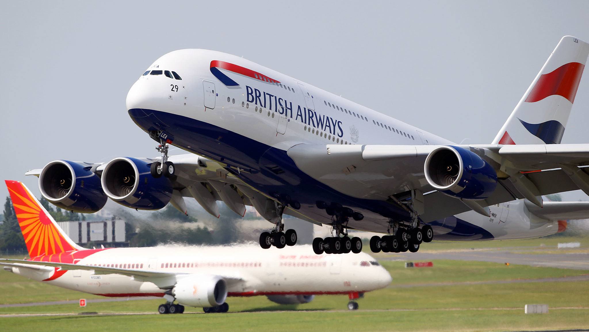 A British Airways Airbus A380 (right) takes off in front of an Air India Boeing 787 during the Paris Air Show at Le Bourget airport in 2013. (AP Photo/Francois Mori, File)