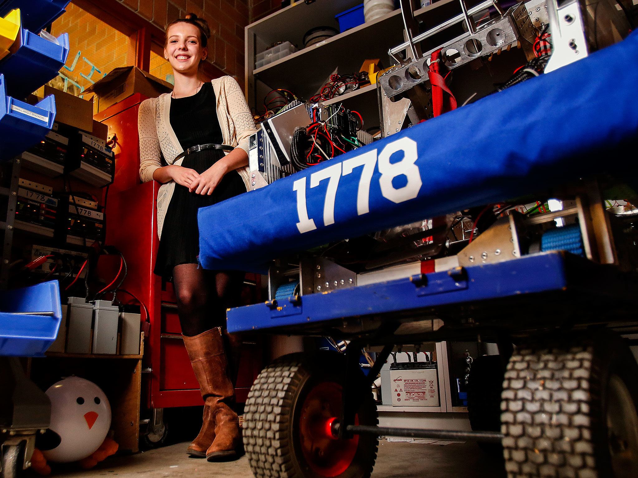 Mountlake Terrace senior, Elizabeth Jurgensen, 17, is part of her school’s STEM program, and is into robotics. She is the Herald Super Kid this week. “Chill,” at right, is a seriously cool robot. (Dan Bates / The Herald)