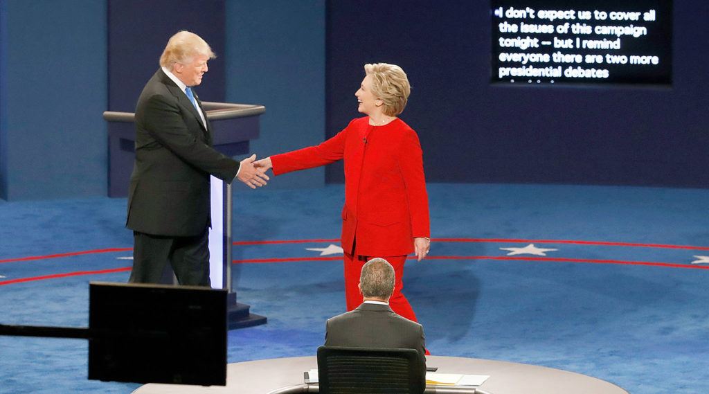 Democratic presidential nominee Hillary Clinton (right) shakes hands with Republican presidential nominee Donald Trump at the start of the presidential debate at Hofstra University in Hempstead, New York, on Monday. (AP Photo/Mary Altaffer) 
