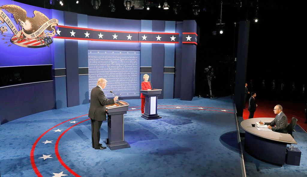 Republican presidential nominee Donald Trump speaks on stage with Democratic presidential nominee Hillary Clinton during the presidential debate at Hofstra University in Hempstead, New York, on Monday. (Rick T. Wilking/Pool via AP)
