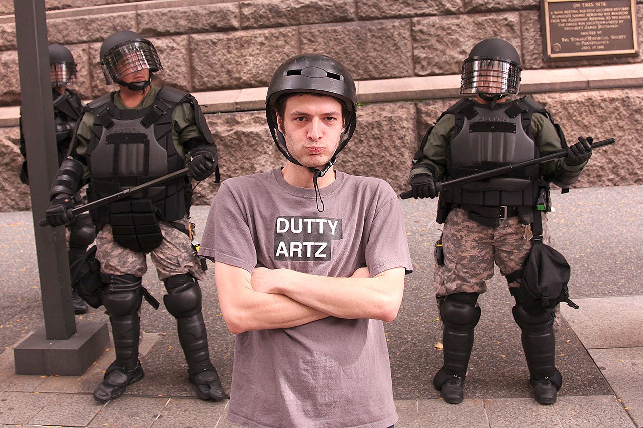Paolo Pedercini, a professor at Carnegie Mellon University, is shown on a downtown Pittsburgh street during the G-20 Summit in 2009. (Richard Pell)
