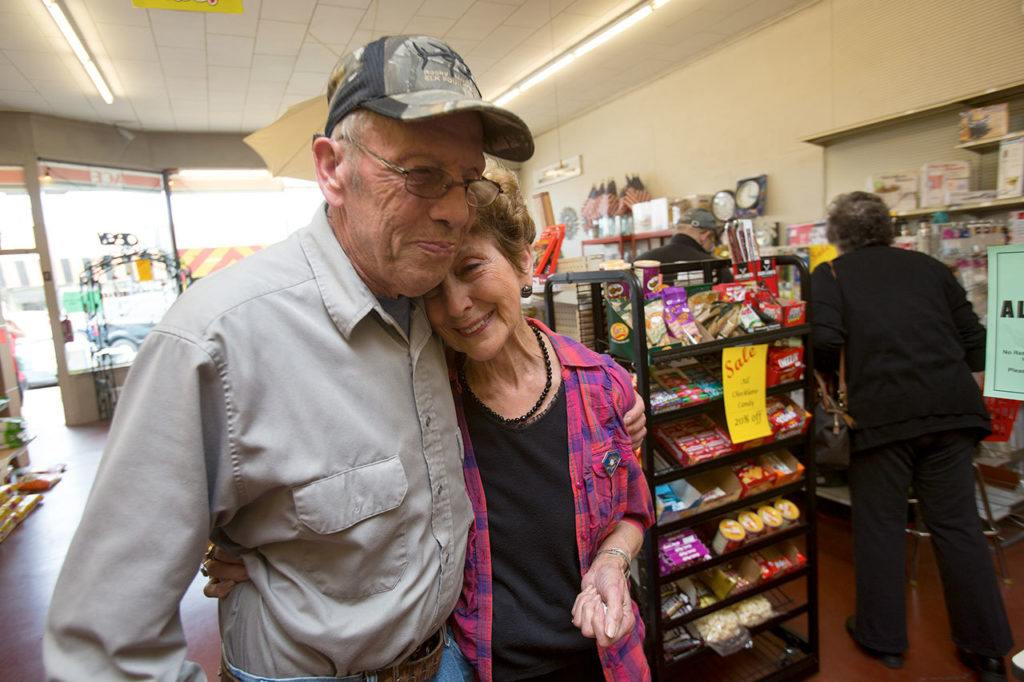 Dale Smith gives Carr’s Hardware owner Darlene Scott a hug Friday as they talk about the history of the store in Marysville. Carr’s Hardware is closing after 93 years in business. (Andy Bronson / The Herald)
