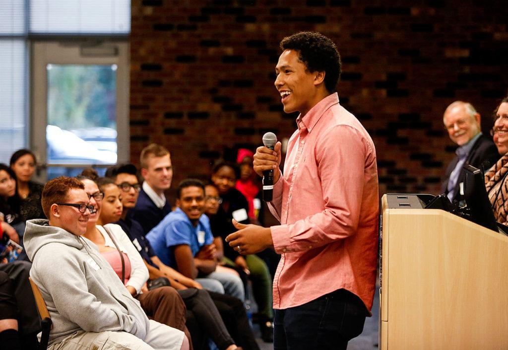At a kickoff event for the Rotary Club of Everett’s support of Everett School District’s AVID program, Christian Paige, 23, engages the audience with a dynamic performance of spoken word poetry. A poet, and a recent graduate of Trinity Lutheran College, Paige helped start a mentoring program for high school students called the Hope Initiative. (Dan Bates / The Herald)
